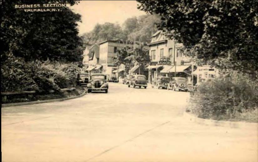 Image of a historic postcard with a photo of the Business Section of Valhalla